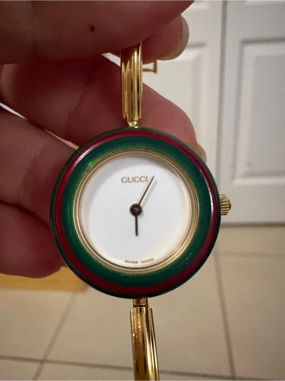 Gucci Gold-Tone Bangle Watch with Multicolor Interchangeable Bezels